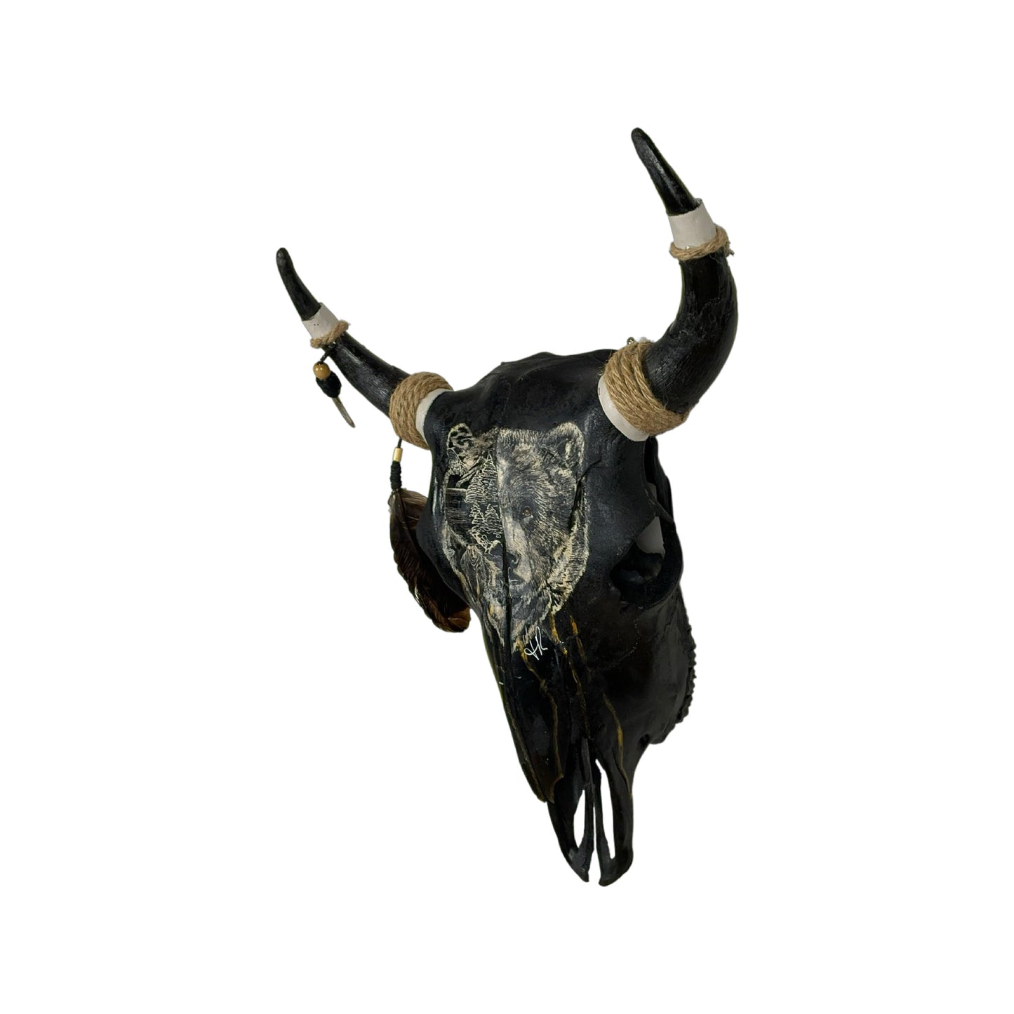A Young Bull Engraved Skull Taxidermy Wall Decor featuring a bear head and a landscape