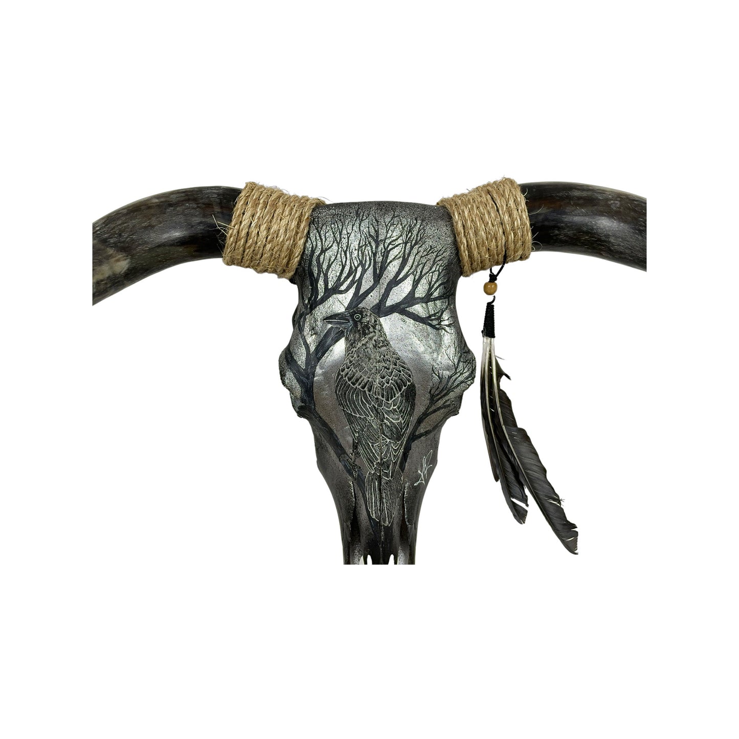 A Bull Engraved Skull Taxidermy Wall Decor featuring a crow perched on a tree