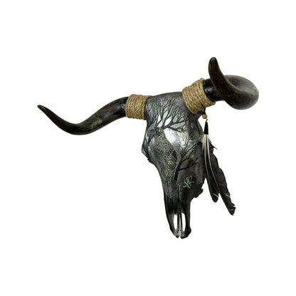 A Bull Engraved Skull Taxidermy Wall Decor featuring a crow perched on a tree