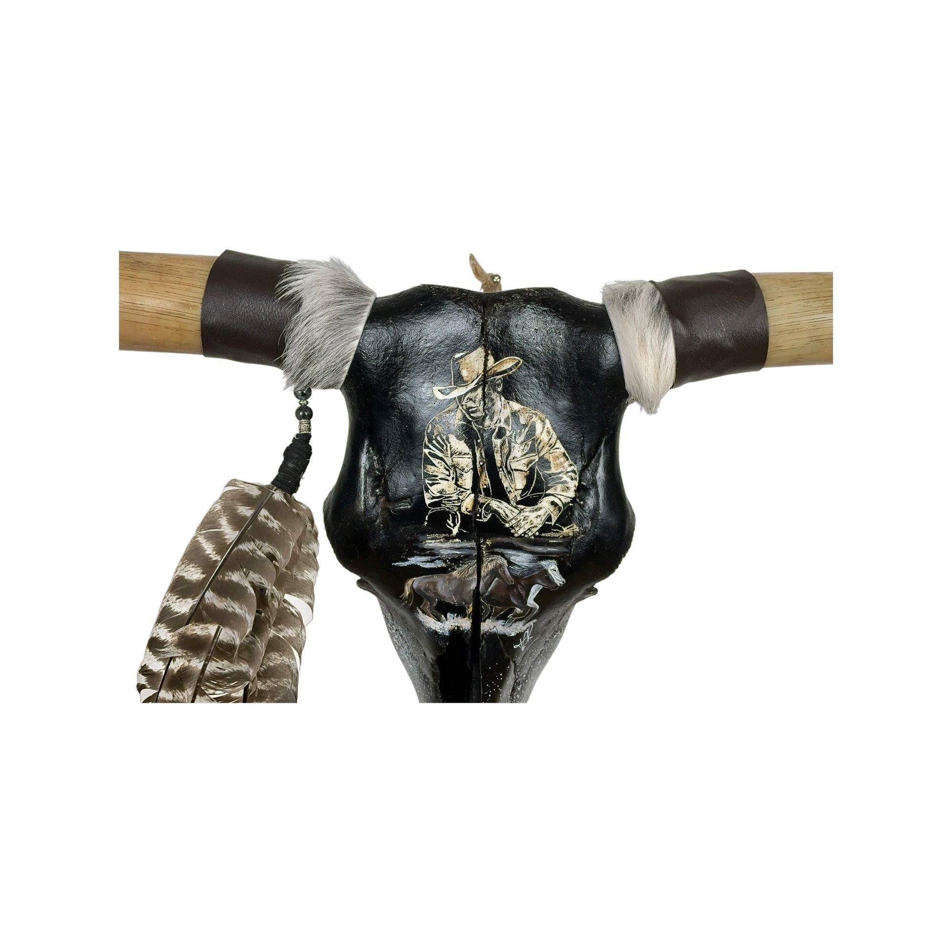 A Longhorn Engraved Skull Taxidermy Wall Decor featuring a cowboy with horses
