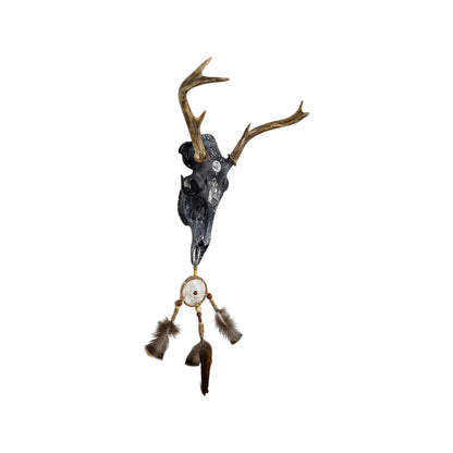 A White-Tailed Deer Engraved Skull Taxidermy Wall Decor featuring a wolf and a dream catcher
