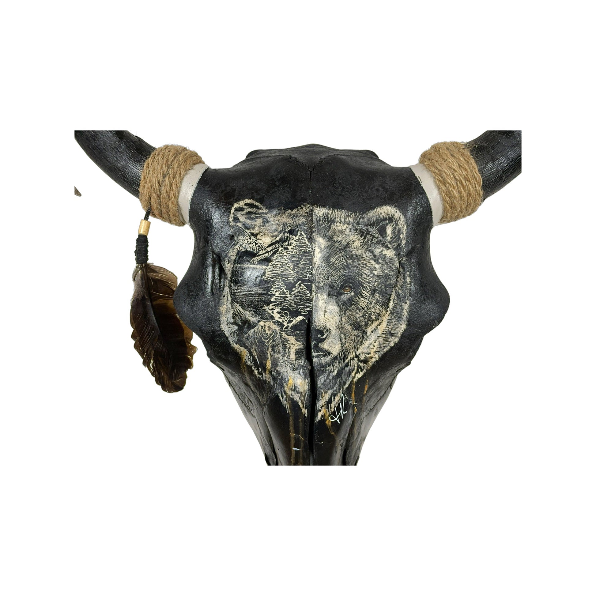 A Young Bull Engraved Skull Taxidermy Wall Decor featuring a bear head and a landscape